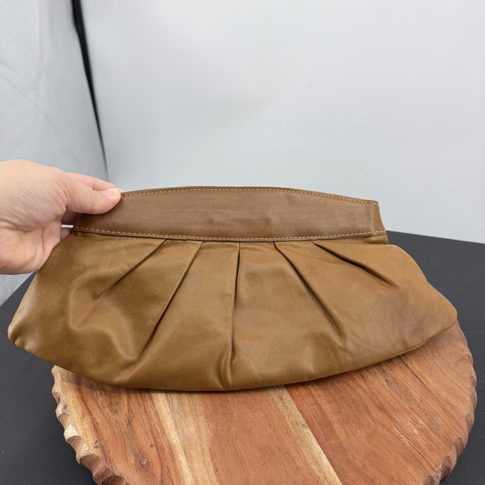 Fossil brown leather pleated clutch hinge opening
